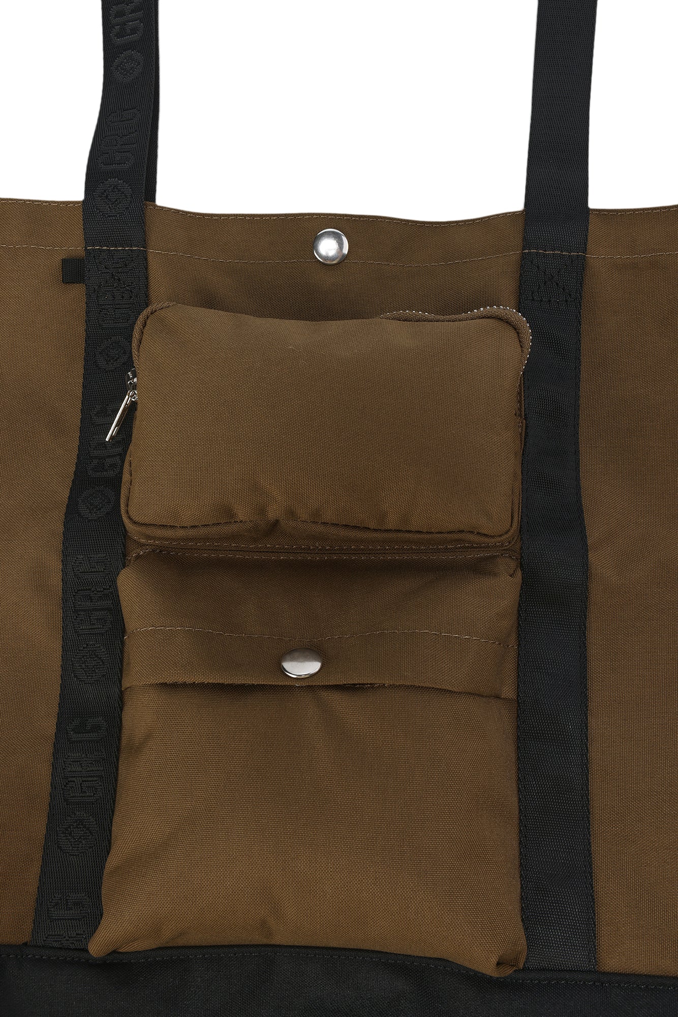 Brown tote bag with black straps and a small pouch attached on a white background