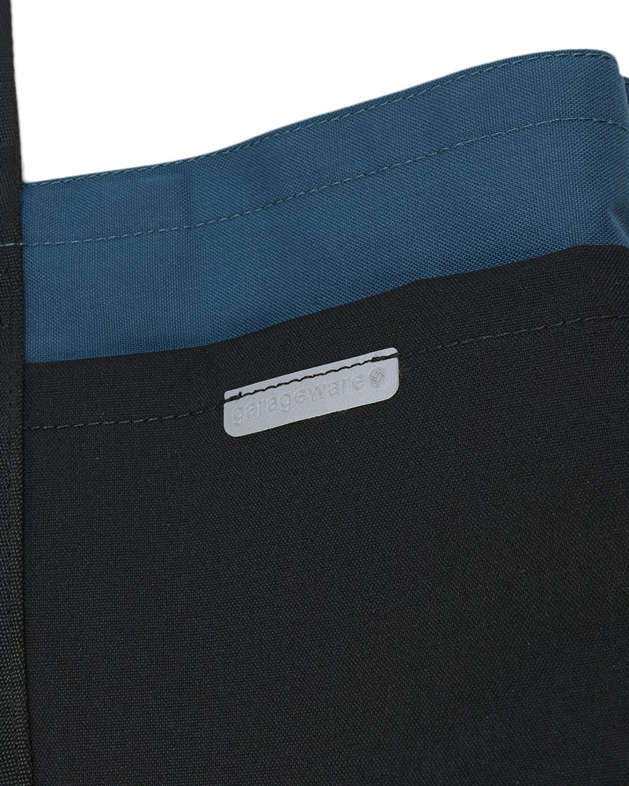 Blue and black tote bag with a visible brand logo on a white background